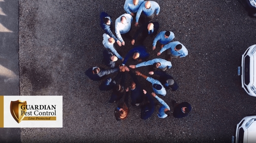 Aerial view of a group of people putting their hands together